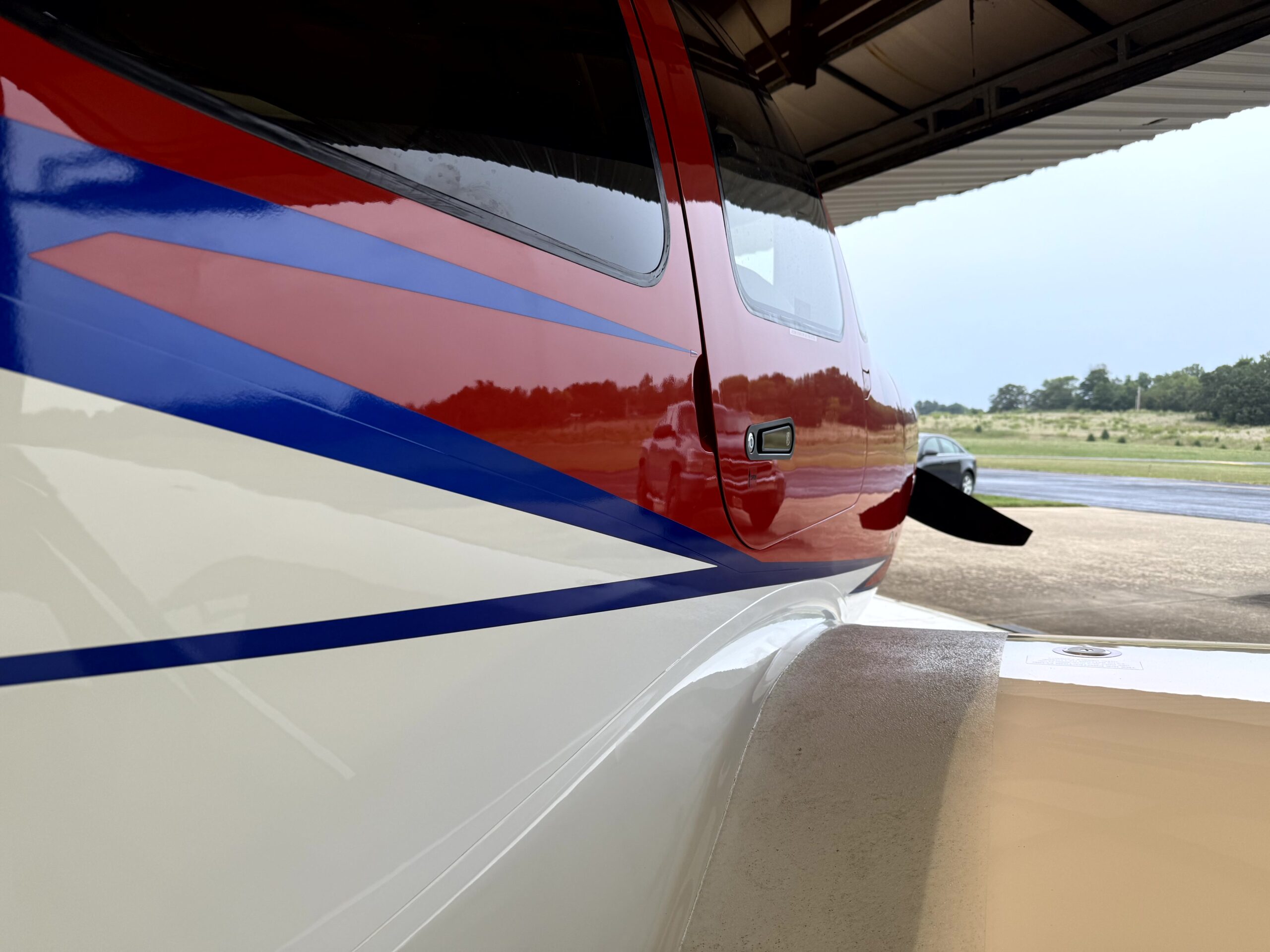 JL Specialties aviation detailing: aircraft on tarmac at hangar