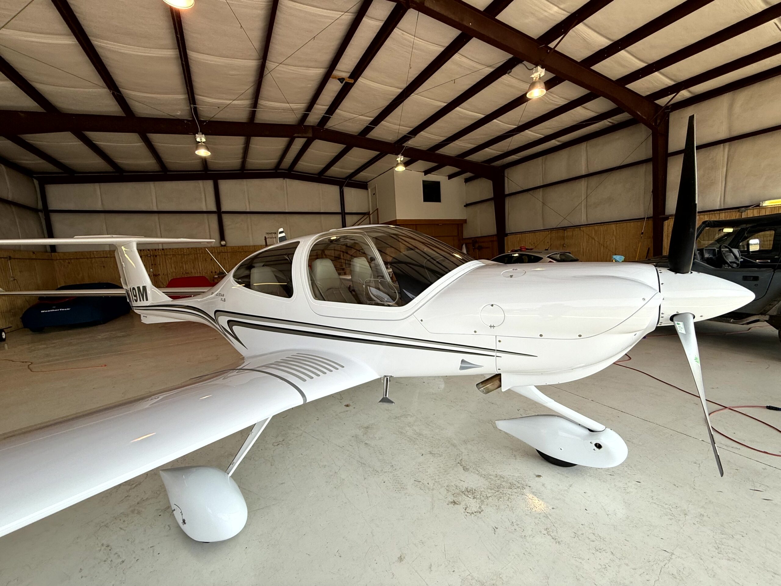 JL Specialties aviation detailing professional working on a private aircraft at hangar in West Plains MO
