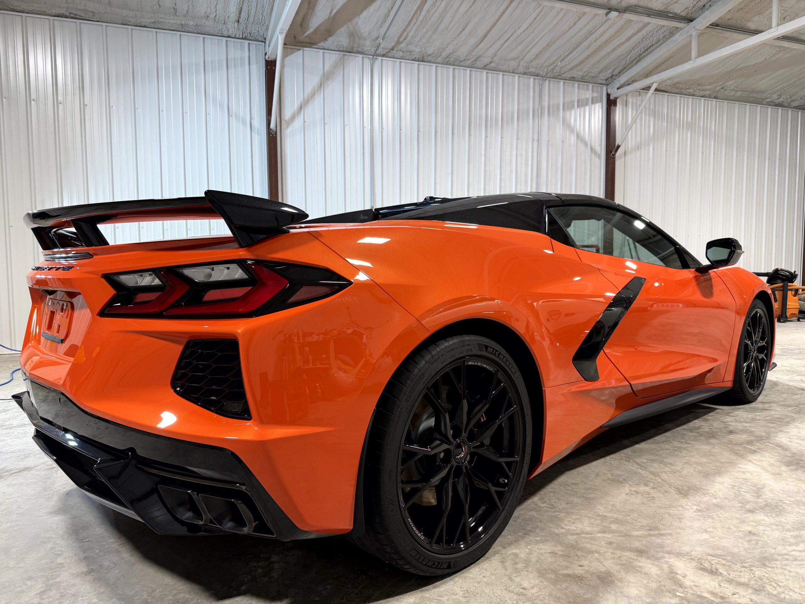 JL Specialties ceramic coating application: liquid polymer being applied to vehicle paint surface in West Plains MO