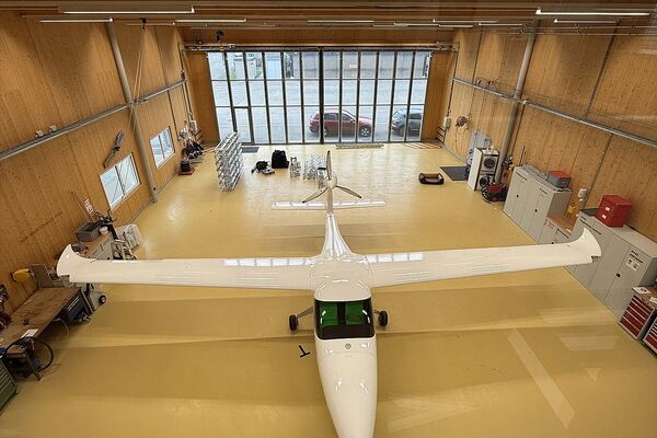 Small private aircraft in maintenance hangar showing sensitive components for protection during detailing