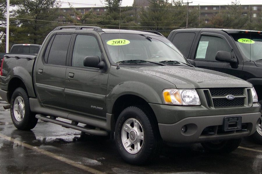 Tubular side step bars installed below the doors of a Ford Explorer Sport Trac
